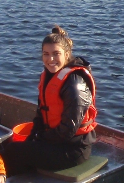 Saddie Vela on a jon boat on Muskegon Lake